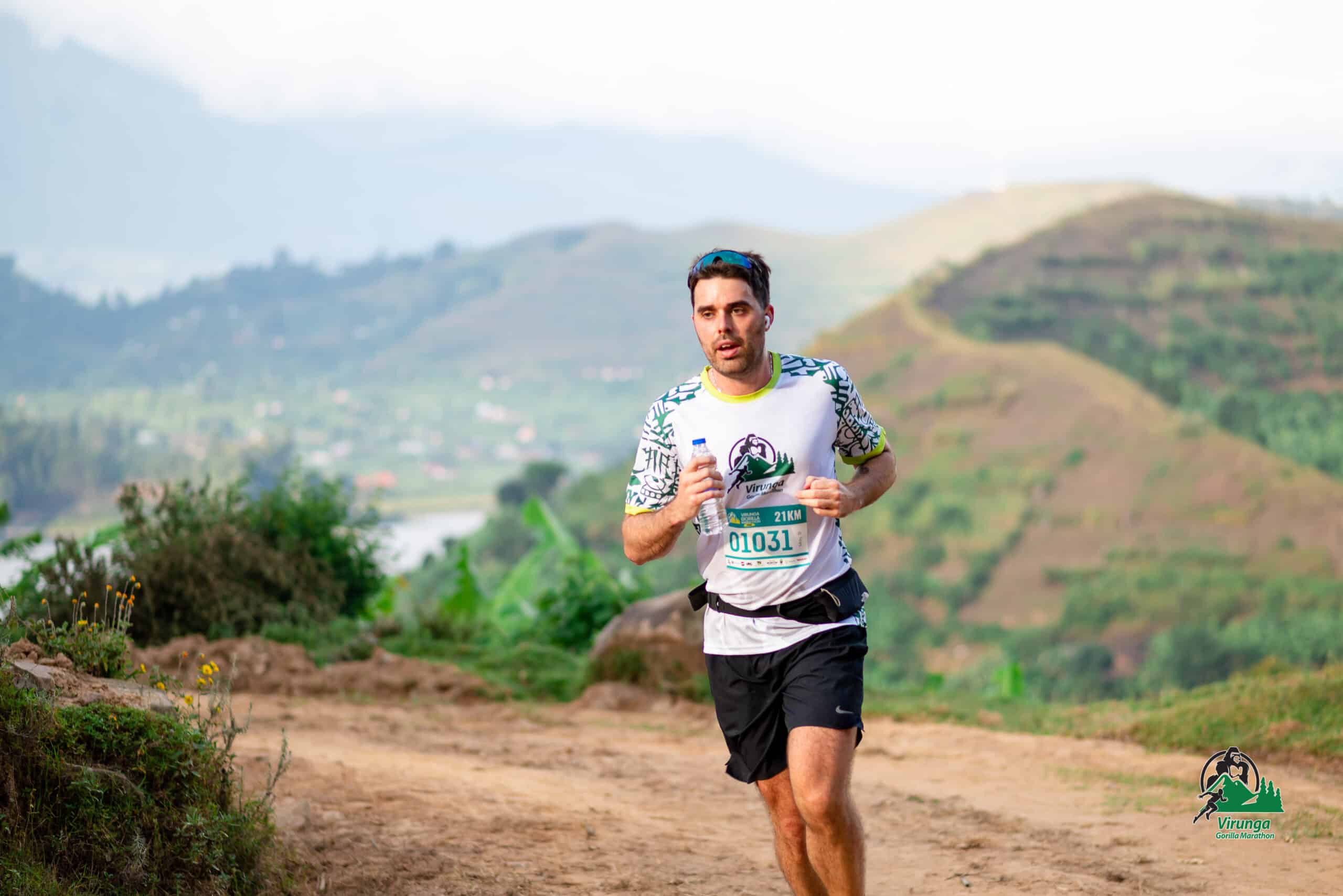 A Virunga Gorilla Marathon runner on a mountain trail above Kisoro